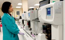 Luz Thomas, Senior MT, observes Hematology results. Luz Thomas, Senior MT, observes Hematology results.