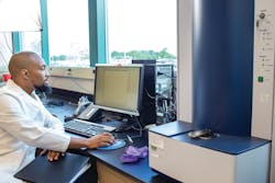 Figure 1. Bacterial identification by MALDI-TOF. A laboratory technologist is analyzing clinical samples using a MALDI-TOF mass spectrometer. The bacterial protein profile spectrum for a sample is shown on the computer screen. The MALDI-TOF instrument is on the right (Photo courtesy of the Biomedical Laboratory Diagnostics Program at Michigan State University). Figure 1. Bacterial identification by MALDI-TOF. A laboratory technologist is analyzing clinical samples using a MALDI-TOF mass spectrometer. The bacterial protein profile spectrum for a sample is shown on the computer screen. The MALDI-TOF instrument is on the right (Photo courtesy of the Biomedical Laboratory Diagnostics Program at Michigan State University).