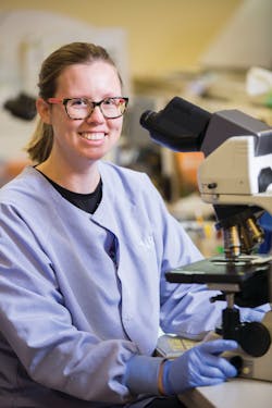 Lisa Harper, medical lab scientist, performing a cell differential Lisa Harper, medical lab scientist, performing a cell differential