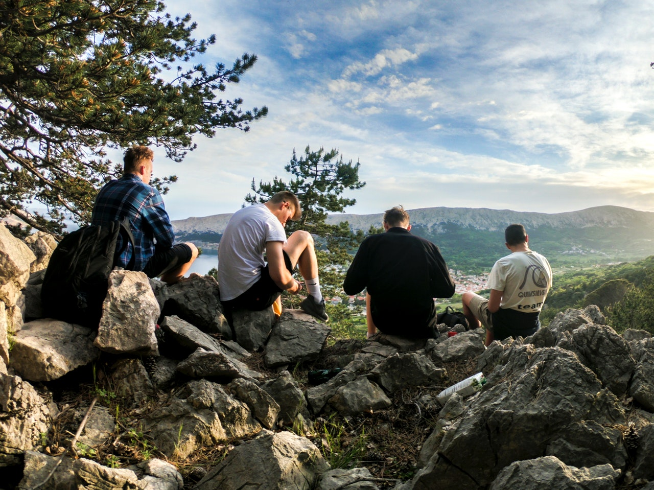 Pixabay Four Men Seated On Rocks Facing Mountain 1070492 5e7a16bbb99df