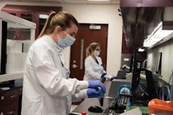 Lead Medical Technologist Jillian Trueman, foreground, and Laboratory Manager Leah Fontana &mdash; both with the Clinical Pathology Special Testing Immunology Laboratory at Beaumont Hospital, Royal Oak &mdash; run validation testing on new antibodies testing equipment.