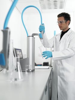 Scientist dispensing water from the ELGA PURELAB Flex 2. Scientist dispensing water from the ELGA PURELAB Flex 2.