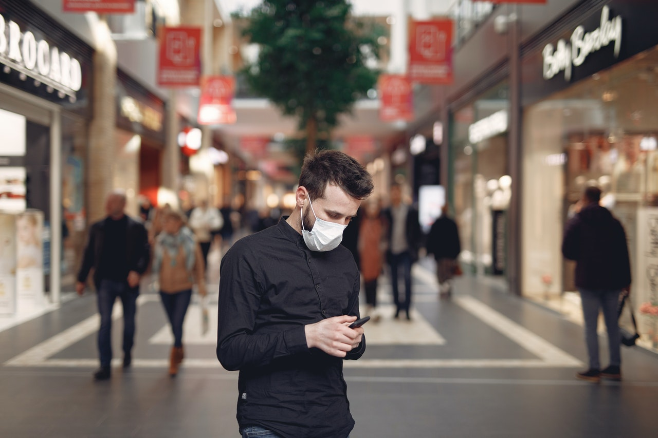 Pexels Young Man In Disposable Mask Using Smartphone In Middle Of 3983435 5ecfb9e18343b
