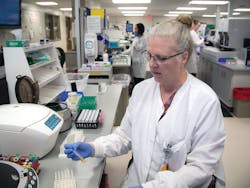 Lisa Miller, MLS, processing specimens in core lab Lisa Miller, MLS, processing specimens in core lab