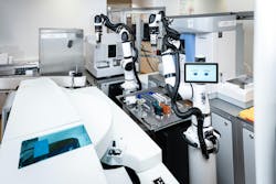 Figure 1: Robot at Asklepios Klinik Bad Oldesloe clinic in Germany performs sample handling and instrument operation previously the purview of only human lab personnel. Photos courtesy of Medilys. Weltpremiere - Labor Hamburg - MEDILYS Laborgesellschaft mbH. Medilys.de. Accessed March 20, 2024. https://www.medilys.de/weltpremiere/. Figure 1: Robot at Asklepios Klinik Bad Oldesloe clinic in Germany performs sample handling and instrument operation previously the purview of only human lab personnel. Photos courtesy of Medilys. Weltpremiere - Labor Hamburg - MEDILYS Laborgesellschaft mbH. Medilys.de. Accessed March 20, 2024. https://www.medilys.de/weltpremiere/.