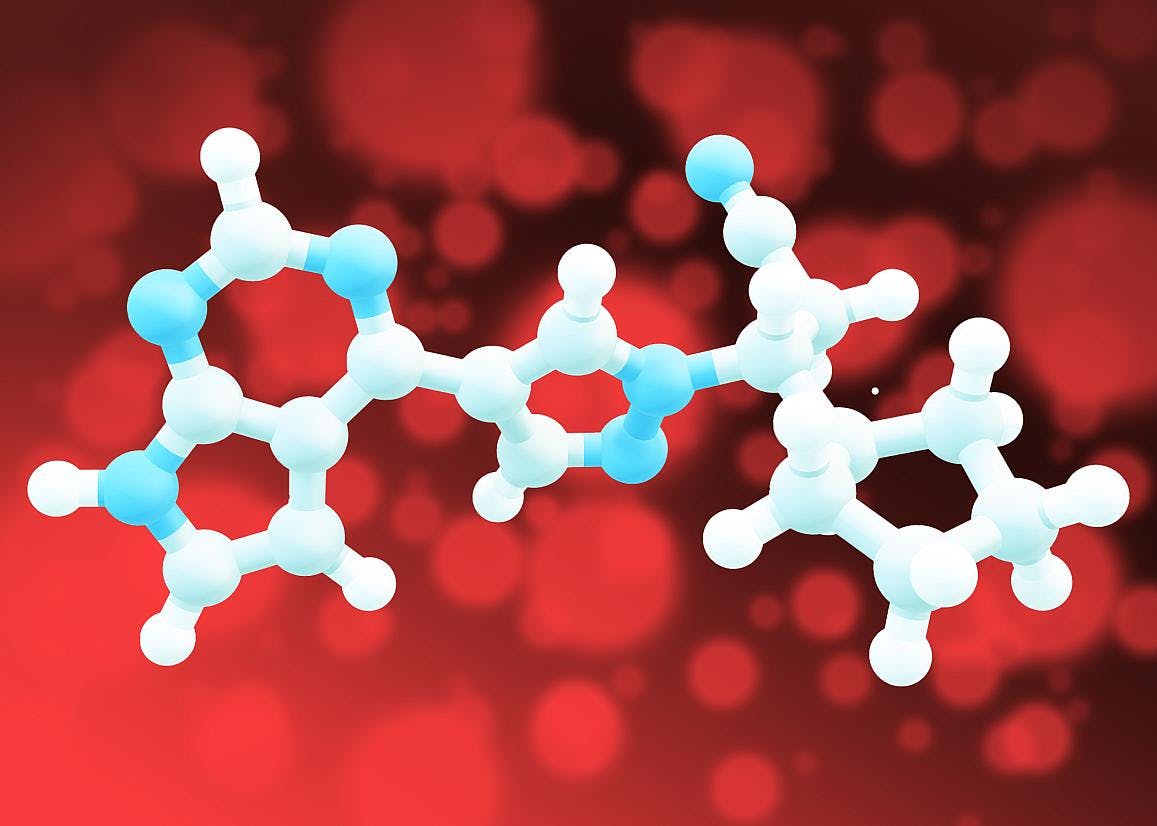 A white and blue model of a molecule shown using connected balls and pegs on a speckled red background. NIAID.