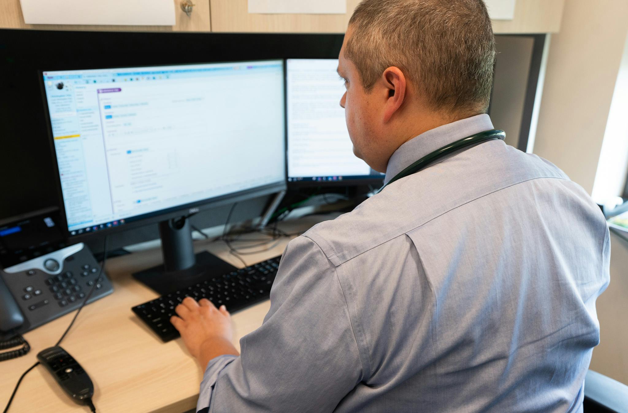 Harrison Jackson, MD, edits his patient appointment notes, something that now takes much less time using an AI app that drafts notes during appointments and organizes them into clinically useful information. The pilot program at The Ohio State University Wexner Medical Center improved patient satisfaction and saved doctors an average of 30 minutes each day.